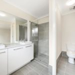 Spacious Bathroom with Grey Tiles — Stoneworks in NSW