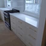 Refurbished Kitchen With White Cabinetry — Custom Stone Benchtops, Vanities And More In Newcastle
