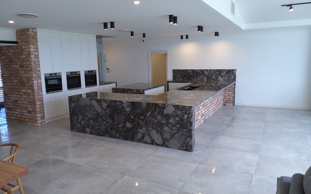 Kitchen With Black Stone Countertop