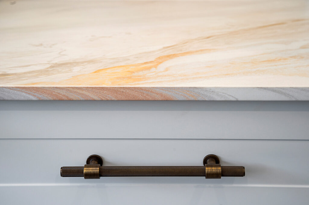 A Stylish Kitchen Counter With a Polished Marble Surface — Vivid Stoneworks in Thornton, NSW
