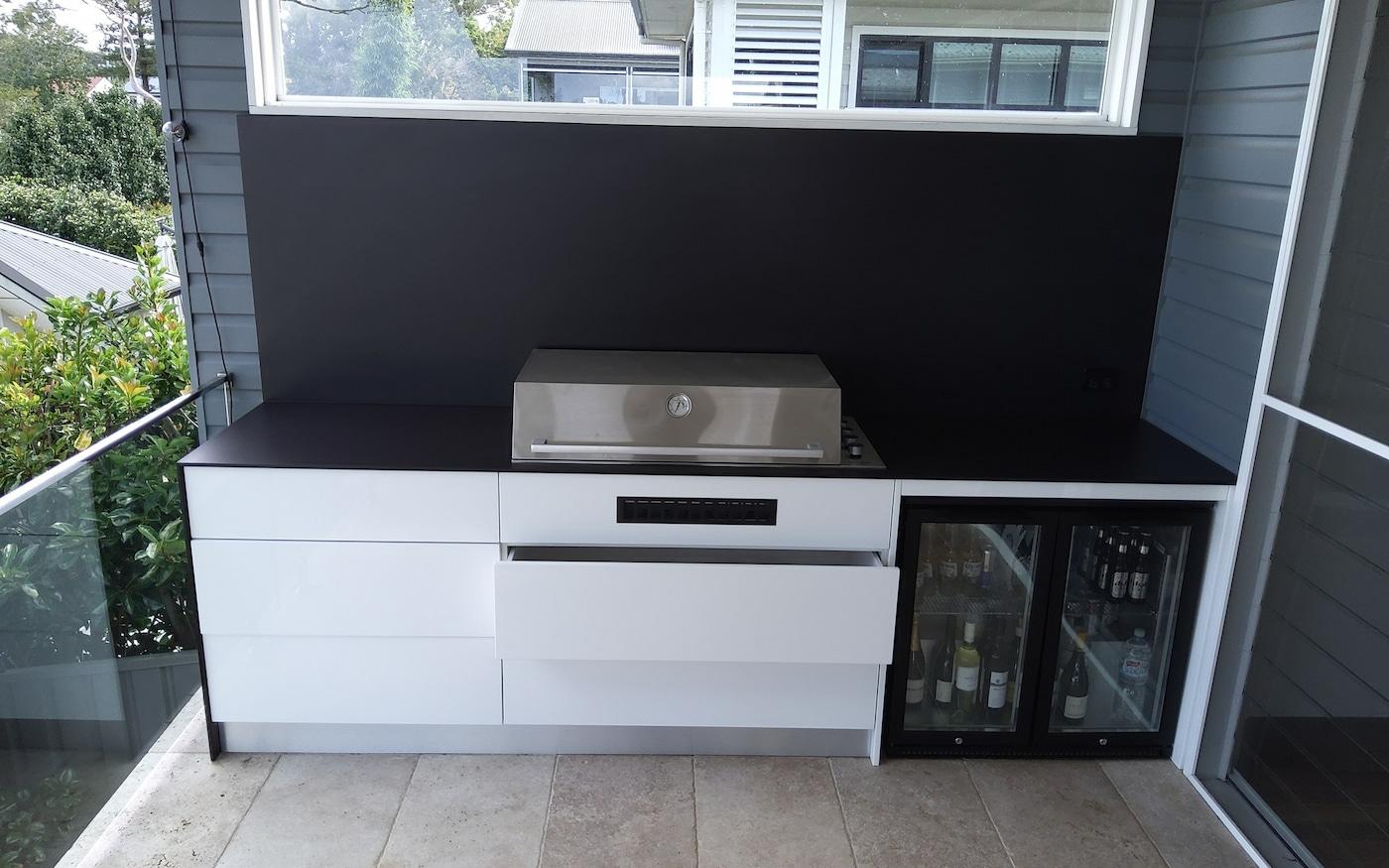 Outdoor Kitchen Area With Black Bench — Custom Stone Benchtops, Vanities And More In Newcastle