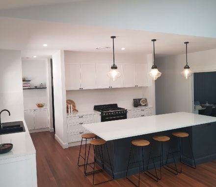 wide shot of a white kitchen with white stone benchtops - Newcastle, NSW